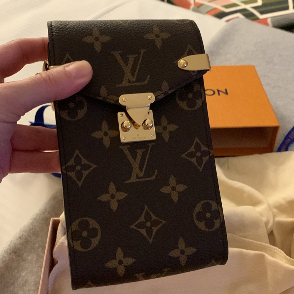 Louis Vuitton monogram authentic new collection small purse with golden chain.